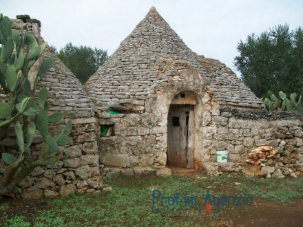 Typical Trullo 4 cones in stone with floor in 